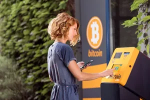 woman using bitcoin atm